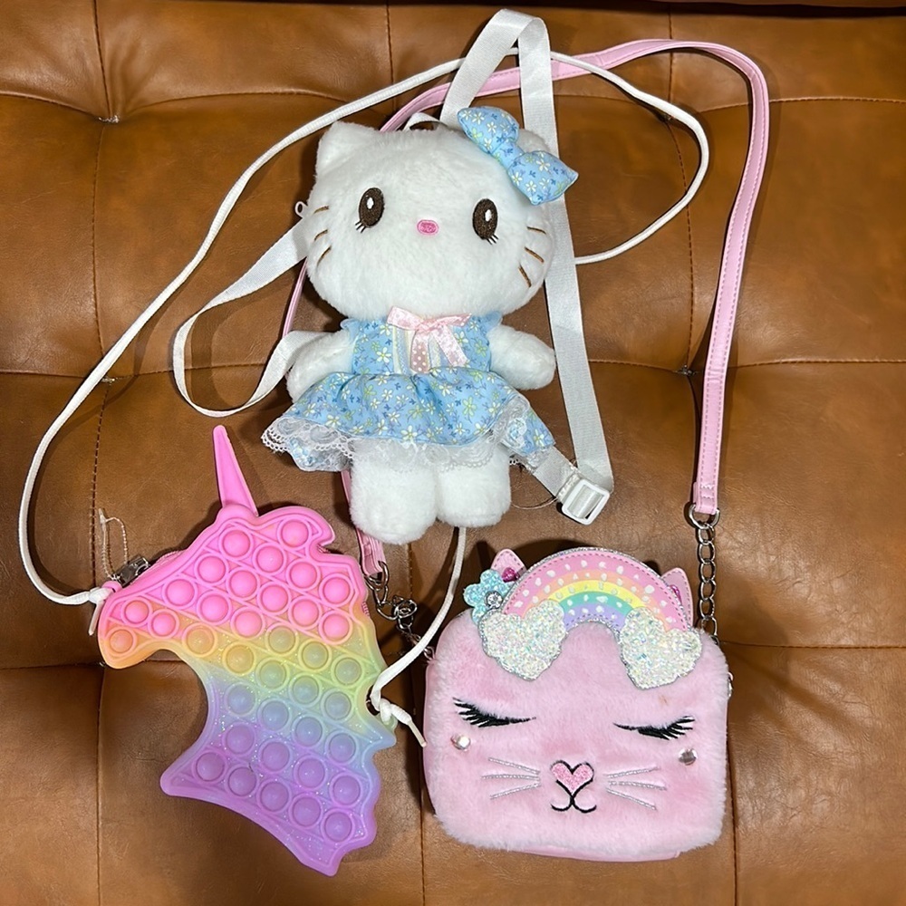 3 girls play purses backpack bags